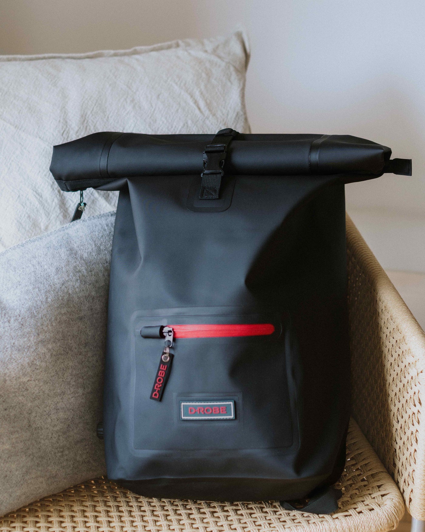Image of midnight black roll-top rucksack, crafted from TPU - a durable, waterproof, recyclable and biodegradable material.