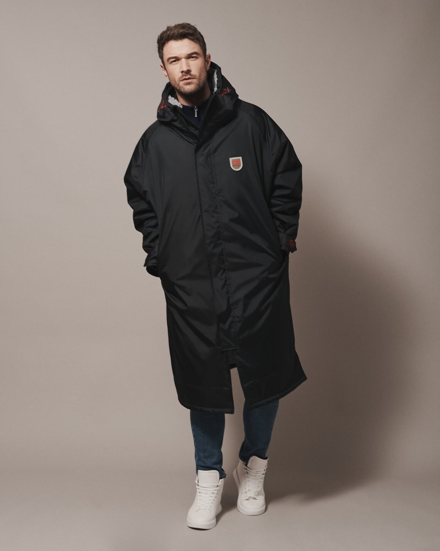All of our robes are intentionally oversized—bigger than usual size—so that you can wrap up warm and have room for any extra layers to adapt to the ever changing weather. You can find the right fit for your robe in our size guide.