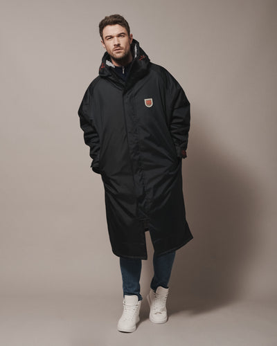 All of our robes are intentionally oversized—bigger than usual size—so that you can wrap up warm and have room for any extra layers to adapt to the ever changing weather. You can find the right fit for your robe in our size guide.
