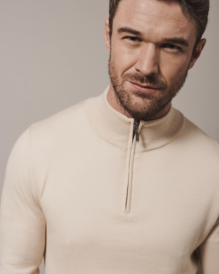 Our extra-fine merino wool 1/4 zip jumpers for men and women in desert sand are made from a lightweight fabric and reactive natural fibre. Ideal for layering under our waterproof dry robes for spectating touchdown sports or walking the dog.