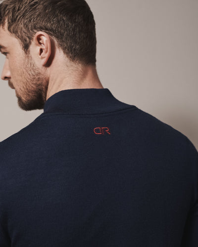 Our merino wool 1/4 zip jumper and crew neck knit jumper for men and women are made from a lightweight fabric and reactive natural fibre. Ideal for layering under our waterproof outdoor robes for spectating touchdown sports or simply keeping warm on a chilly evening at a friends BBQ. Featuring our signature branding on the neck in a red stitch.
