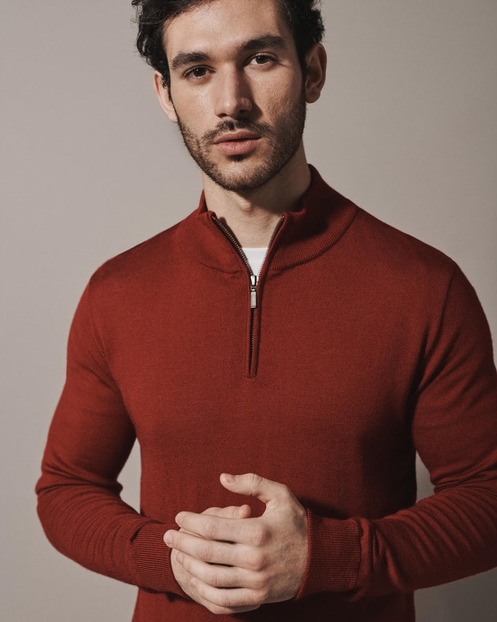 Model wearing our unisex extra-fine merino wool 1/4 zip jumper, made from a lightweight fabric and reactive natural fibre. Ideal for layering under our waterproof dry robes for spectating touchdown sports or walking the dog. The perfect addition to any minimalist capsule wardrobe.