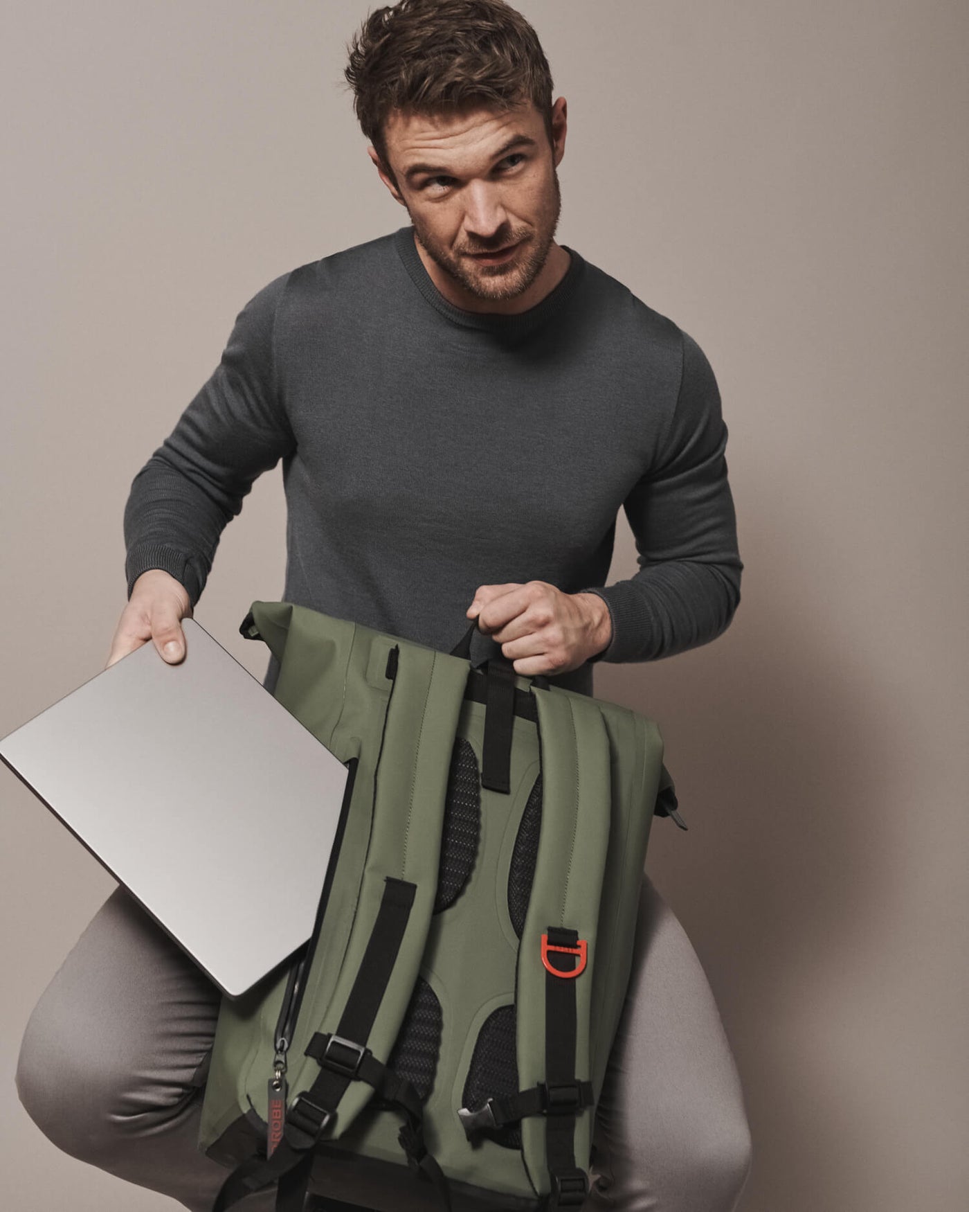 Our moss green roll-top rucksack features an added laptop compartment and front pocket allowing easy organising for your daily commute.