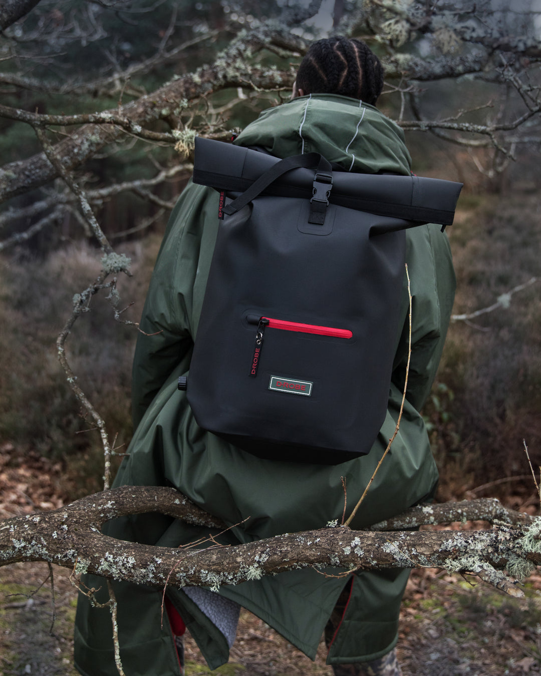 Models in the woodland wearing our functional and stylish outdoor robes and our multi-functional roll-top rucksacks, which have extra storage and waterproof outer for all-weather protection. Perfect as an after swim coat, surf robe, beach coat and dog walking jacket. 