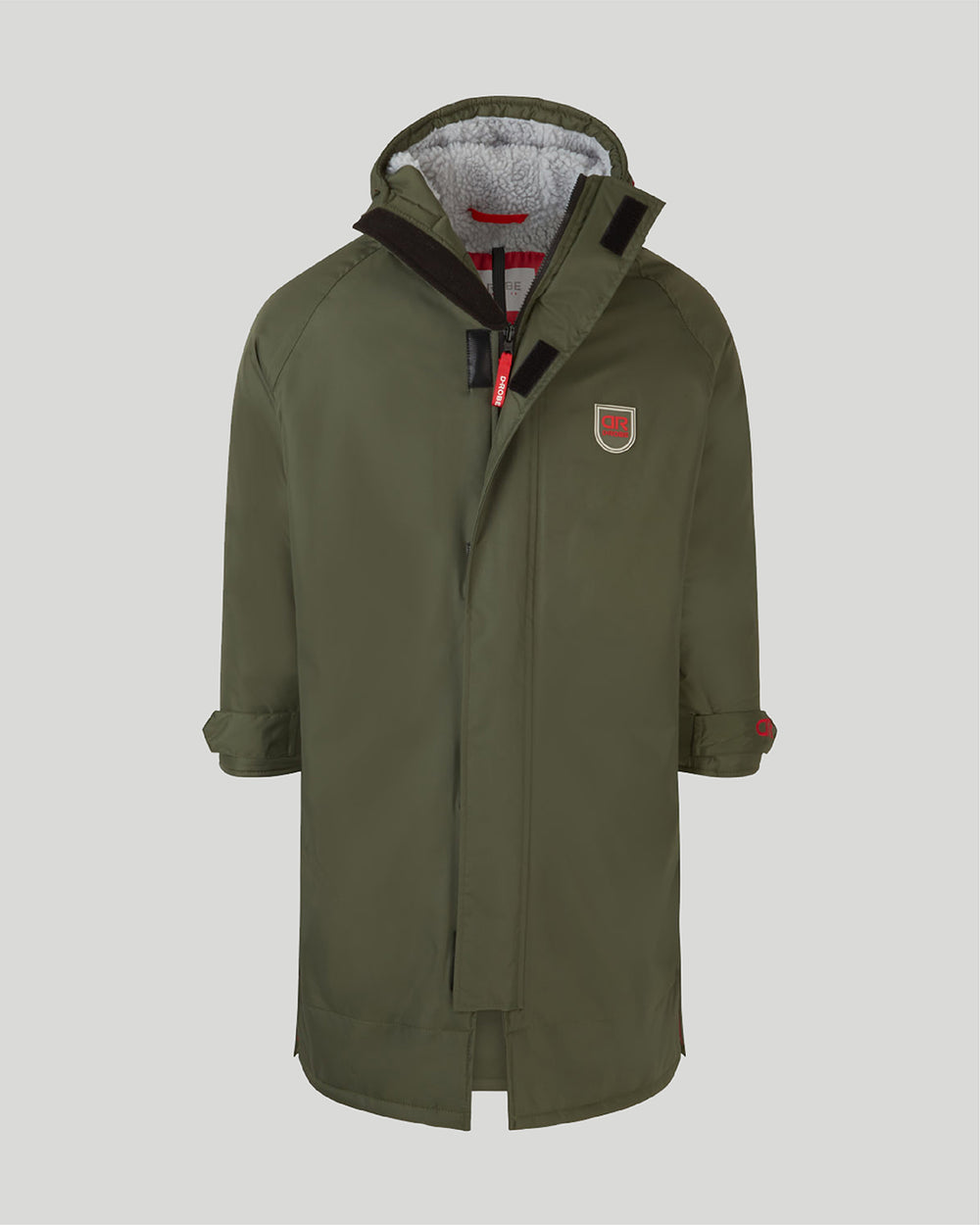 Image of our junior dry robe in Dr Green, made with recycled polyester inner fleece lining and recycled nylon outer shell. It is waterproof, weatherproof, durable, timeless and functional, making it an essential item to all junior outdoor wardrobes.